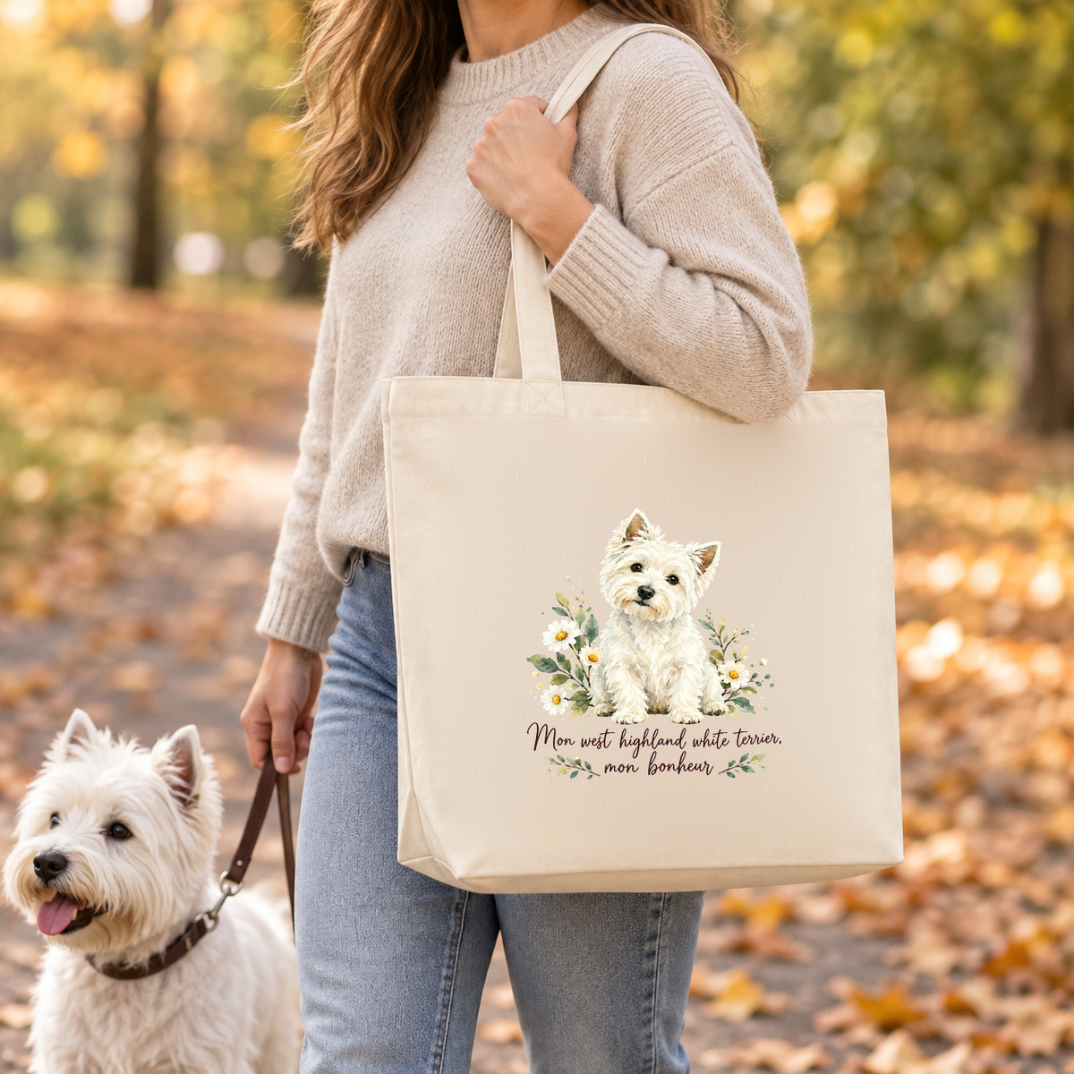 Tote bag west highland white terrier Premium porté à l'épaule lors d'une balade d'automne dans un parc, un westie en laisse