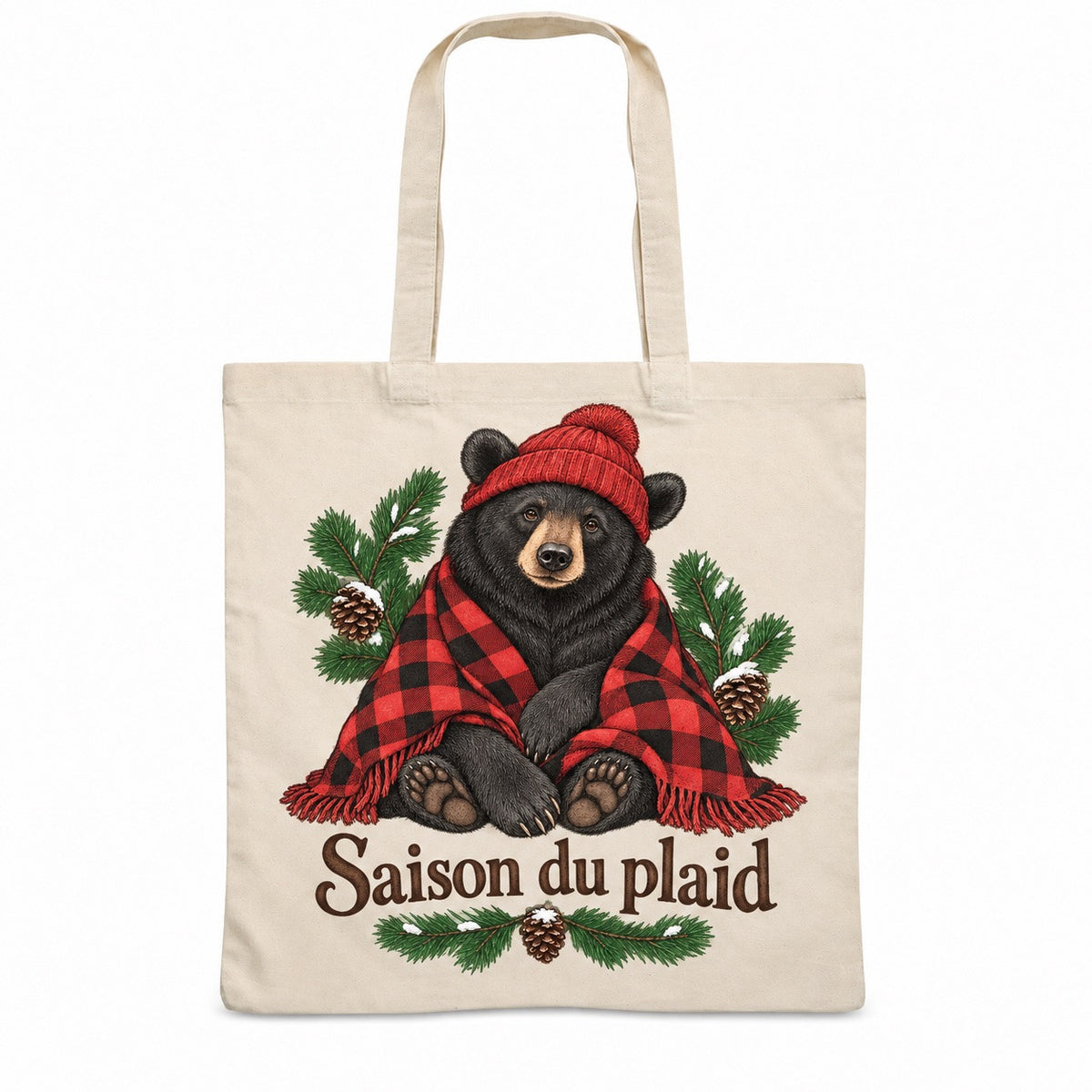 Tote bag « Saison du plaid » Essentiel, sac plat en coton naturel 140 g/m² de 38 × 42 cm, illustration à l'encre : un adorable ours noir assis, coiffé d'une tuque côtelée rouge et enveloppé dans un plaid à grands carreaux bûcheron rouge et noir