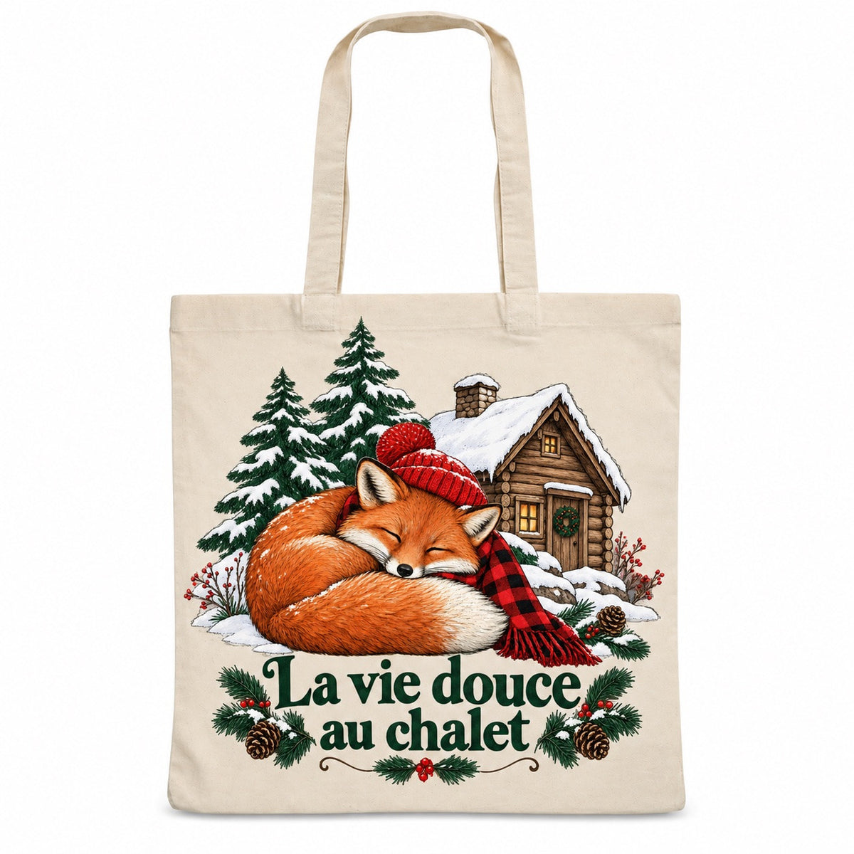Tote bag « La vie douce au chalet » Essentiel, sac plat en coton naturel 140 g/m² de 38 × 42 cm, illustration à l'encre : un renard roux en tuque rouge, blotti en boule devant une petite cabane en bois enneigée et deux pins