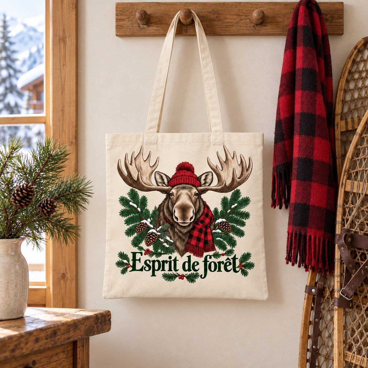 Tote bag « Esprit de forêt » Essentiel suspendu près d'une paire de raquettes