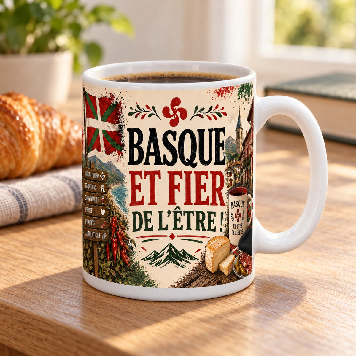 Mug Basque et Fier de l'Être « Euskal Herria » posé sur une table en bois avec un croissant, pause café