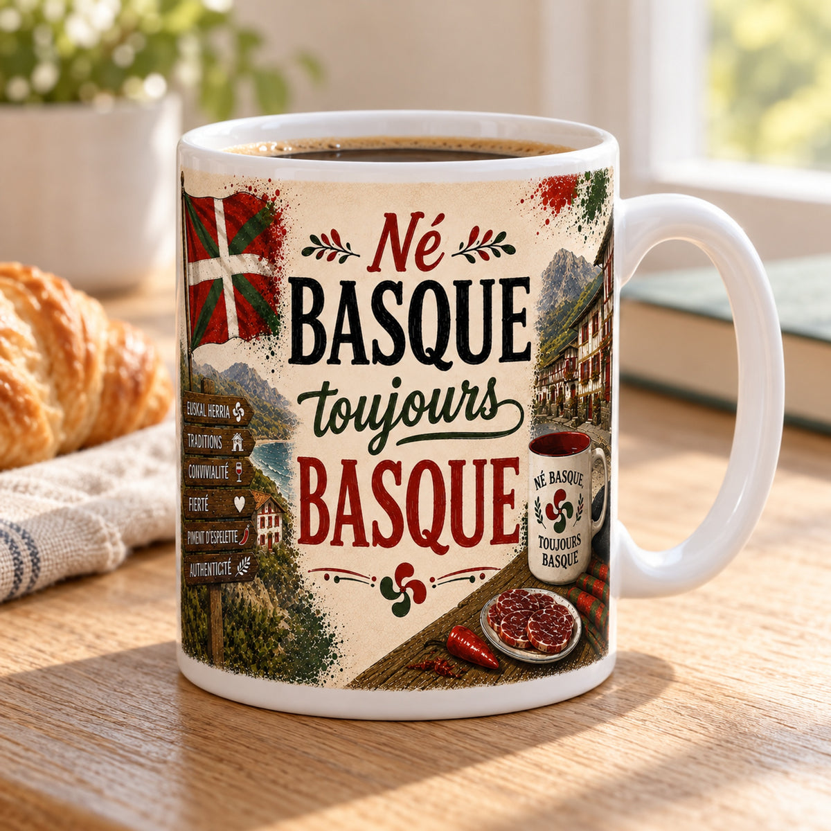 Mug Né Basque, Toujours Basque « Fierté d'Euskal Herria » posé sur une table en bois avec un croissant, pause café
