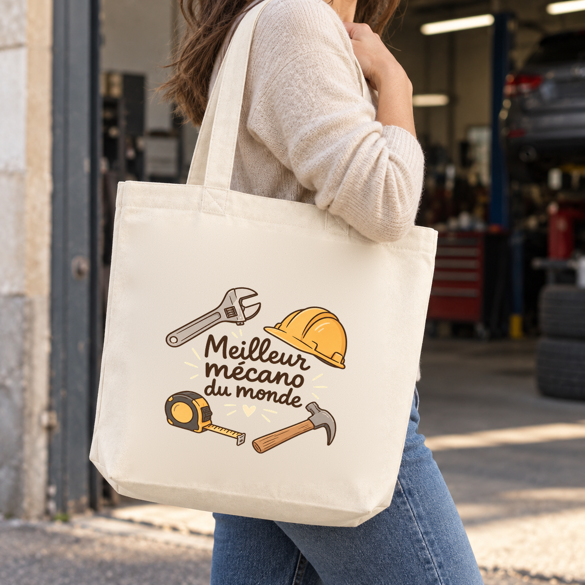 Tote bag mécanicien « Meilleur mécano du monde » Premium porté à l'épaule dans un garage