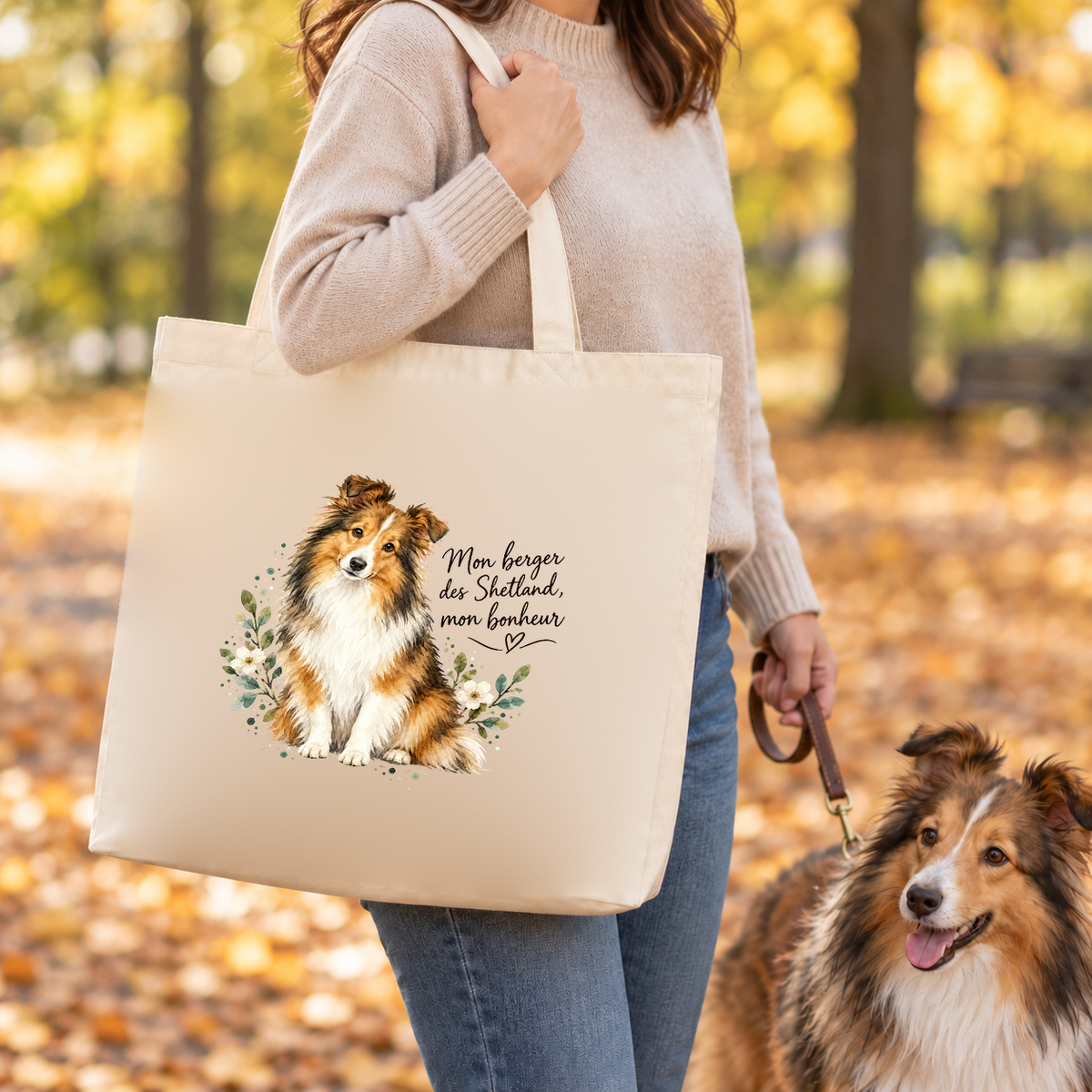 Tote bag berger des Shetland « Mon berger des Shetland, mon bonheur » Premium porté à l'épaule lors d'une balade d'automne dans un parc, un berger des Shetland en laisse