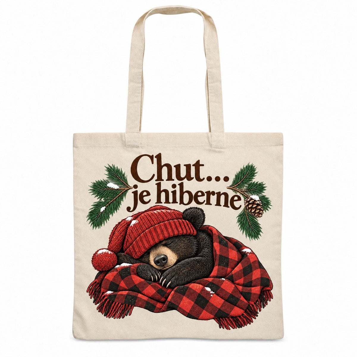 Tote bag « Chut… je hiberne » Essentiel, sac plat en coton naturel 140 g/m² de 38 × 42 cm, illustration à l'encre : un ours noir endormi, bonnet rouge tombant sur les yeux, roulé dans une petite couverture à carreaux bûcheron rouge et noir