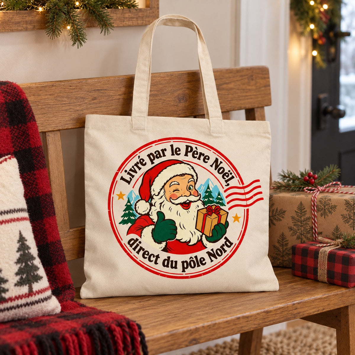 Tote bag « Livré par le Père Noël, direct du pôle Nord » Essentiel posé sur une chaise, décor d'hiver
